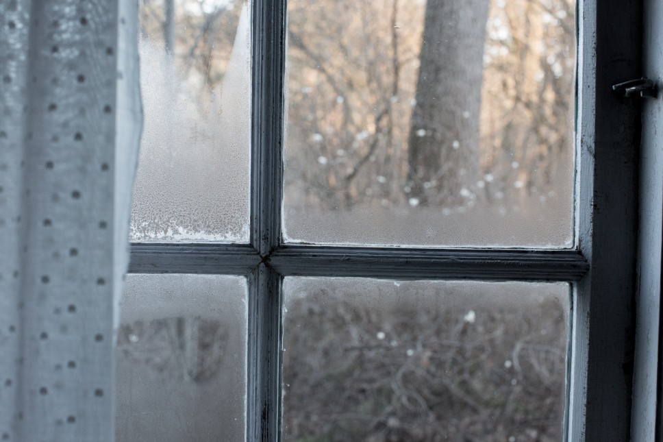 Window with heavy condensation on the frame and glass